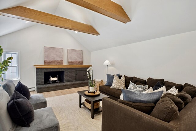 101 Carl Dr NE, Ada, MI 49301 - living area with a baseboard radiator, wood finished floors, a brick fireplace, and recessed lighting