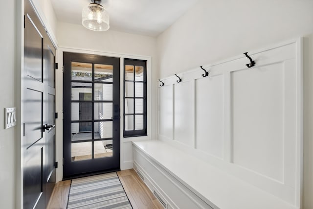 101 Carl Dr NE, Ada, MI 49301 - mudroom featuring french doors and light wood-style flooring