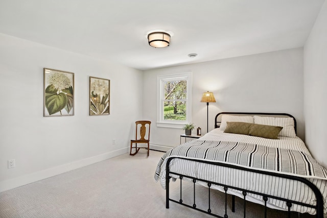 101 Carl Dr NE, Ada, MI 49301 - bedroom featuring light carpet, baseboards, and a baseboard radiator