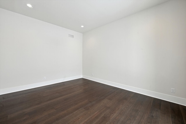 unfurnished room featuring hardwood / wood-style flooring