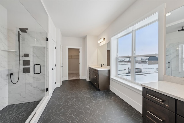 bathroom with vanity and a shower with shower door