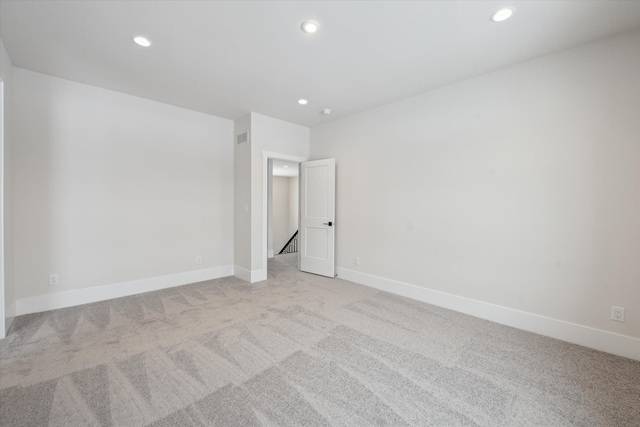 unfurnished bedroom featuring light colored carpet