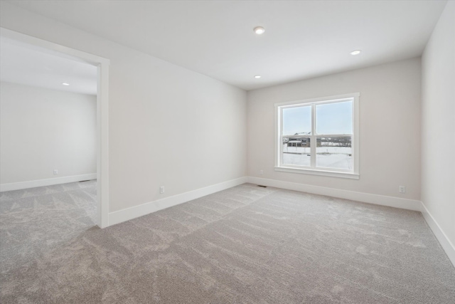 empty room with light colored carpet