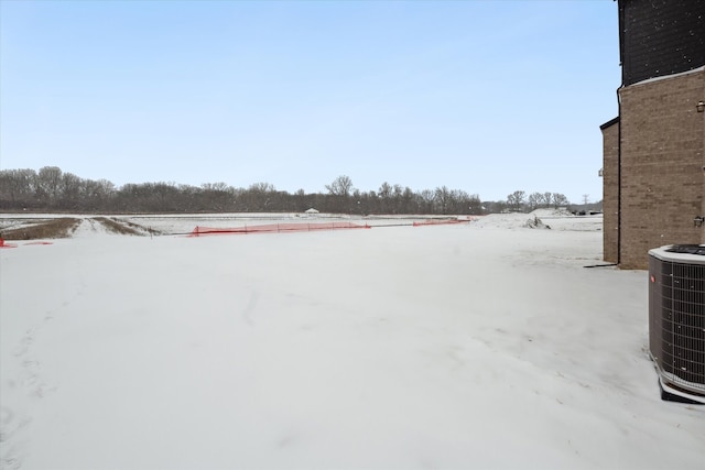 yard covered in snow with cooling unit