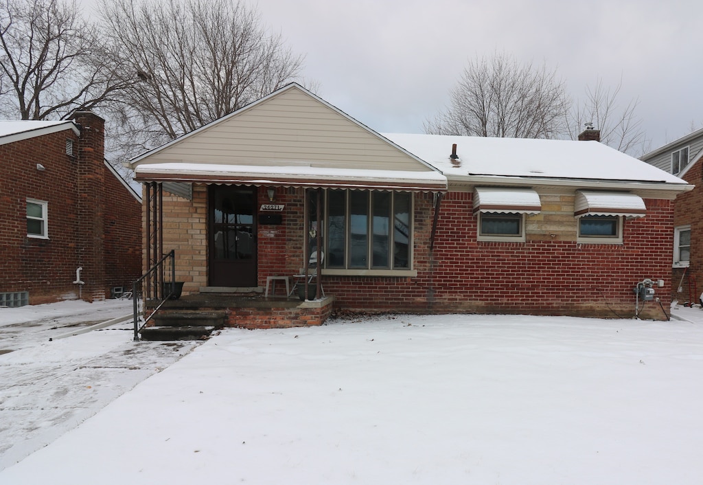 view of snow covered property