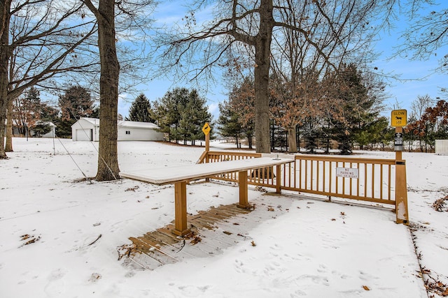 view of yard layered in snow