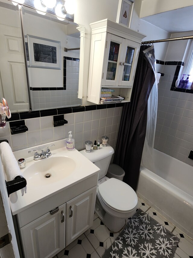 full bathroom featuring shower / bath combination with curtain, backsplash, tile patterned flooring, vanity, and toilet