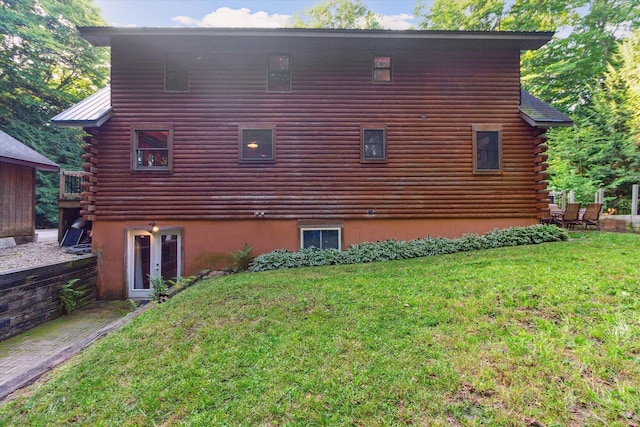 view of home's exterior featuring a yard