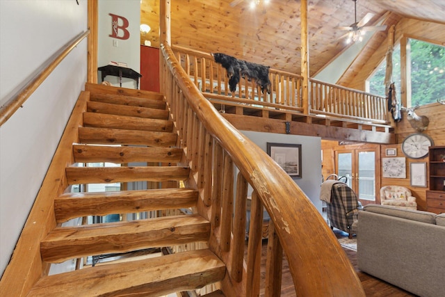 stairs featuring high vaulted ceiling, hardwood / wood-style flooring, ceiling fan, wood ceiling, and french doors