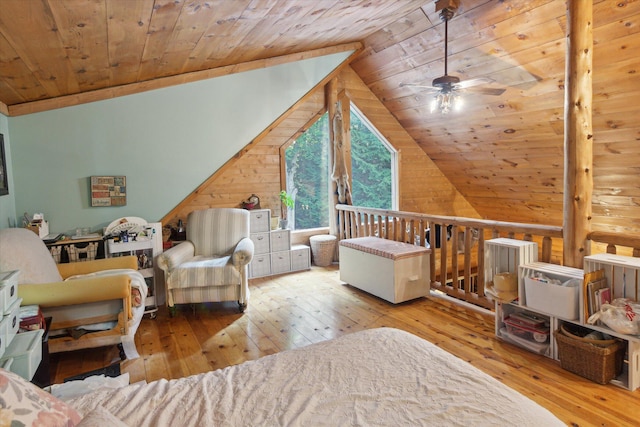 interior space featuring lofted ceiling, light hardwood / wood-style flooring, wooden ceiling, and wood walls