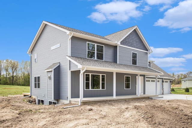 view of front facade featuring a garage and covered porch