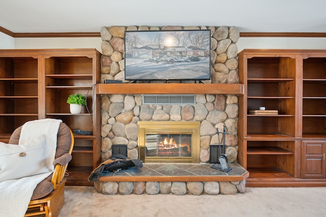 carpeted living room featuring crown molding and a stone fireplace