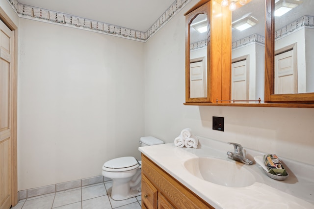 bathroom featuring tile patterned floors, toilet, and vanity