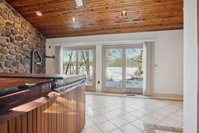 doorway to outside featuring light tile patterned flooring, lofted ceiling, and wooden ceiling