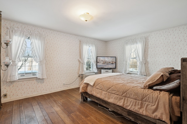 bedroom featuring multiple windows and hardwood / wood-style floors