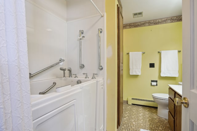 bathroom featuring vanity, a bathtub, toilet, and baseboard heating