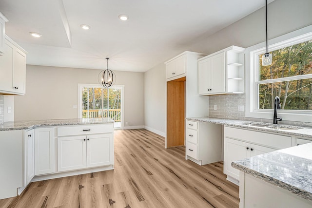 kitchen featuring sink and white cabinets