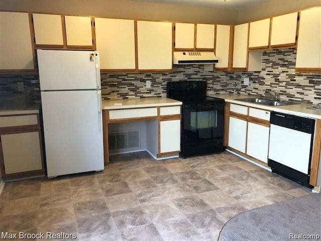 kitchen with sink, backsplash, and white appliances