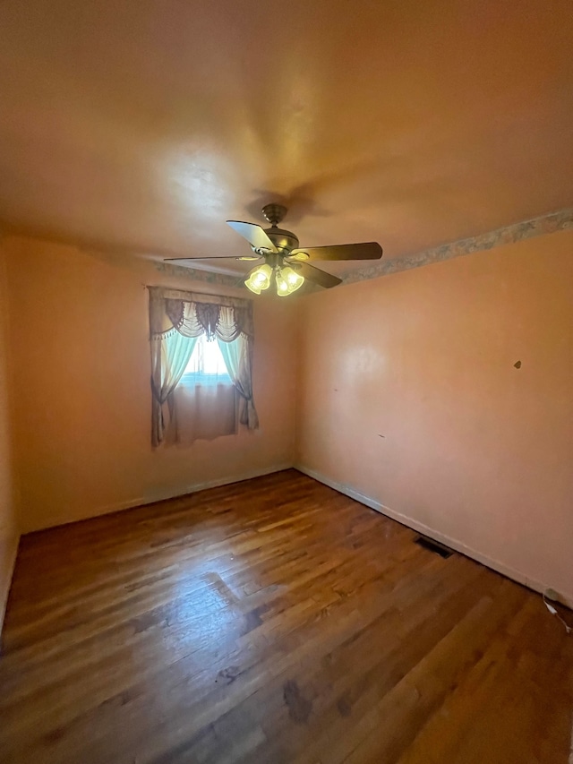 spare room with visible vents and wood finished floors