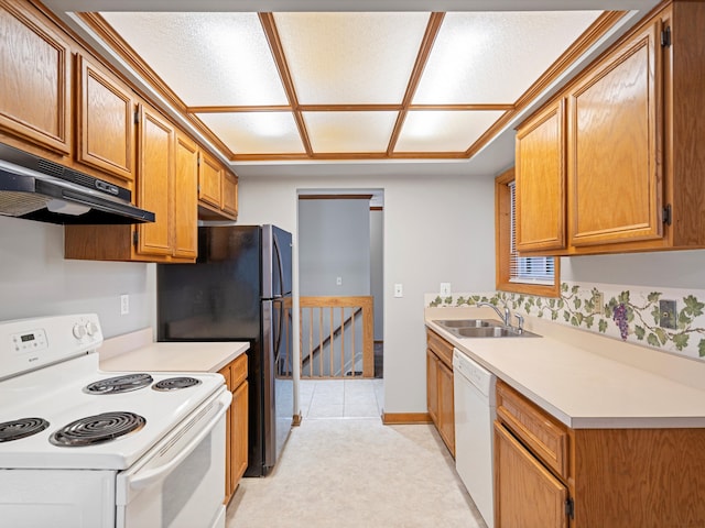 kitchen featuring sink and white appliances