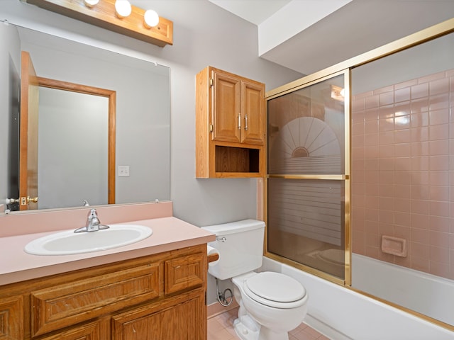 full bathroom with vanity, tile patterned floors, shower / bath combination with glass door, and toilet