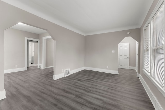 empty room featuring dark wood-type flooring