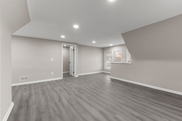 basement with hardwood / wood-style floors