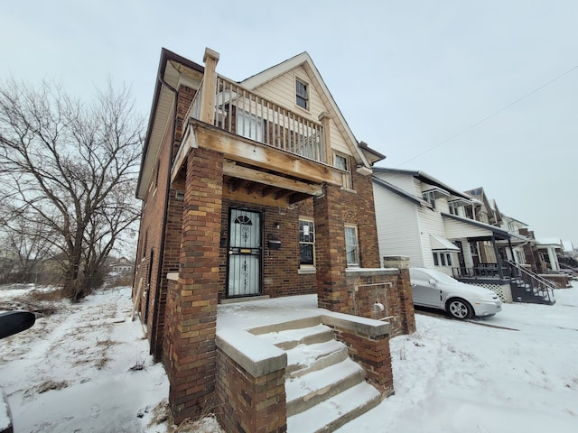 view of front of home with a balcony