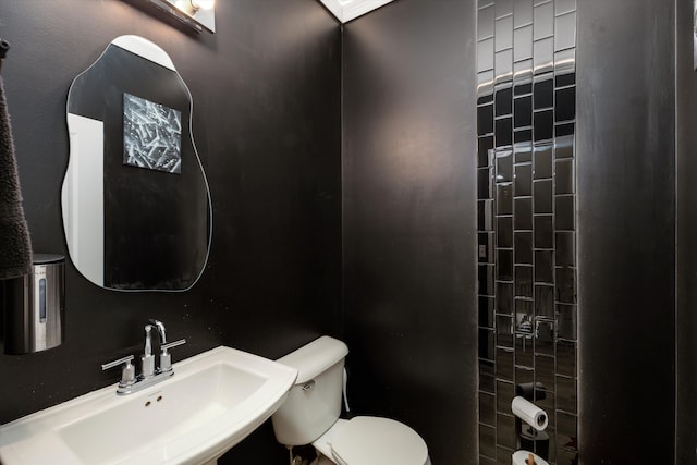 bathroom with sink and toilet