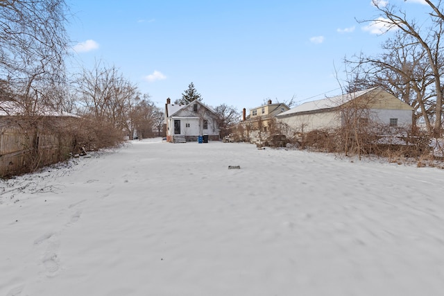 view of yard covered in snow