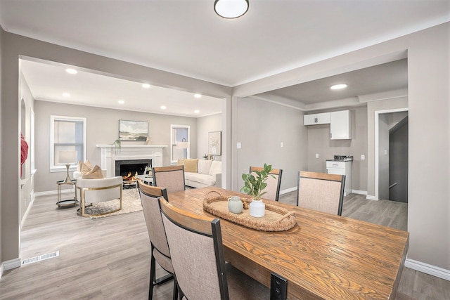 dining area with light hardwood / wood-style flooring