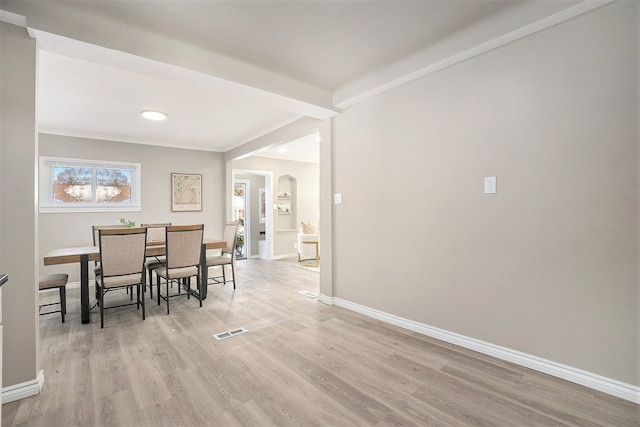 dining area featuring light wood-type flooring