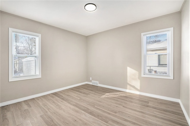 unfurnished room featuring light wood-type flooring