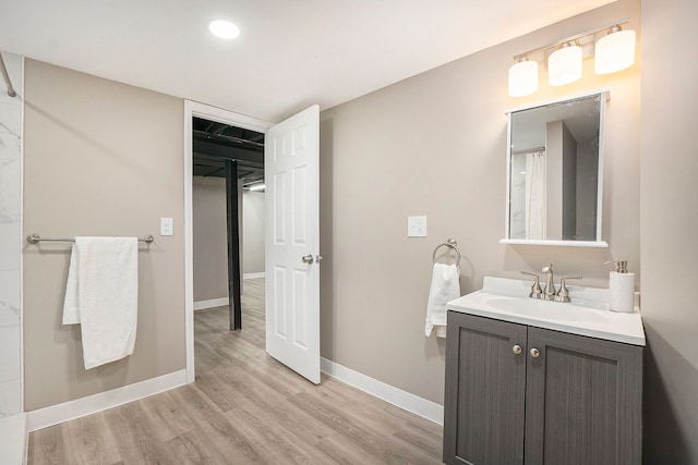 bathroom with vanity and hardwood / wood-style floors