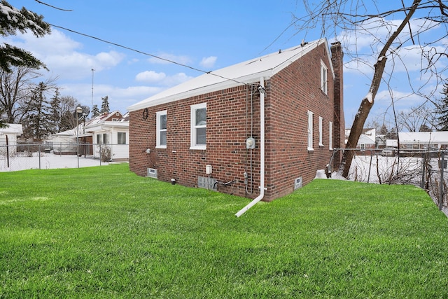 view of home's exterior with a yard