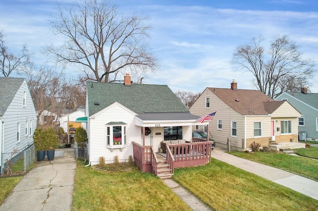 bungalow-style house with a porch and a front lawn