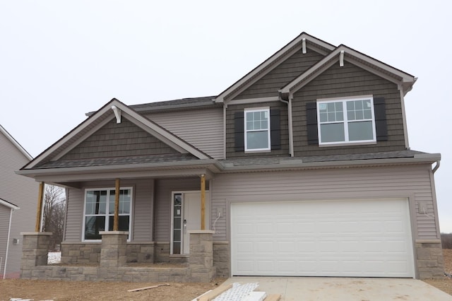 craftsman house featuring a garage