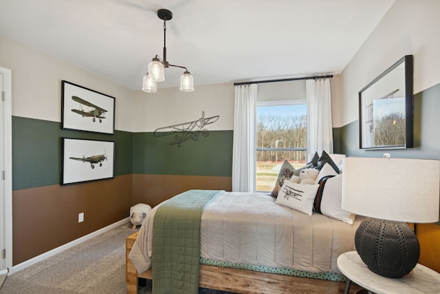 carpeted bedroom with baseboards