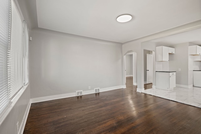 unfurnished living room with hardwood / wood-style floors