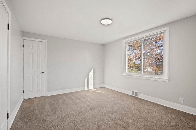 unfurnished room with carpet