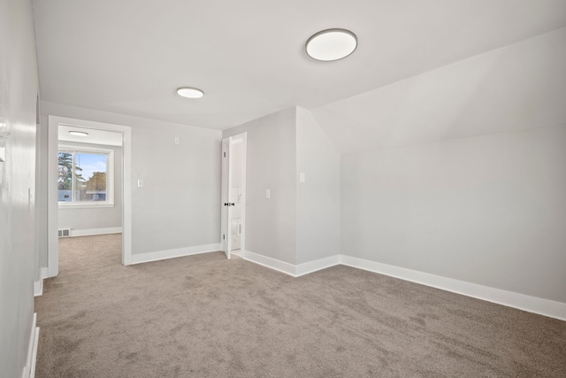 bonus room with carpet flooring