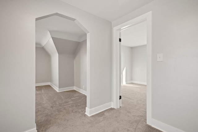 hallway featuring light carpet