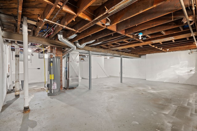 basement featuring heating unit and water heater