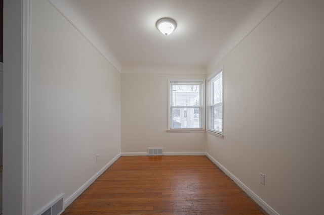 spare room featuring hardwood / wood-style floors