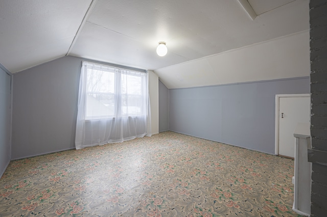 bonus room with vaulted ceiling