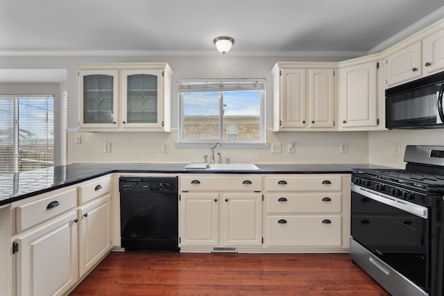 kitchen with crown molding, sink, a healthy amount of sunlight, and black appliances