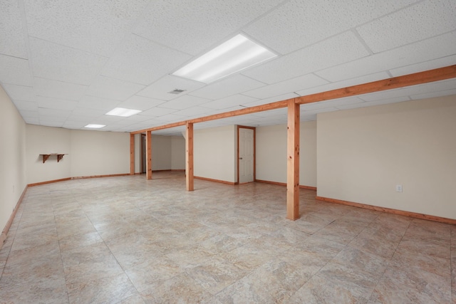 basement featuring a drop ceiling