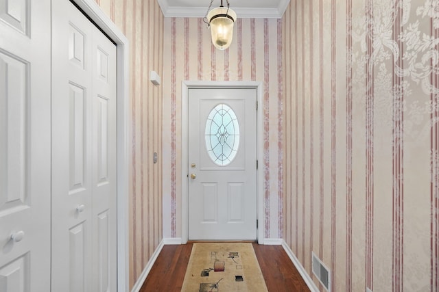 doorway to outside featuring dark wood-type flooring and ornamental molding