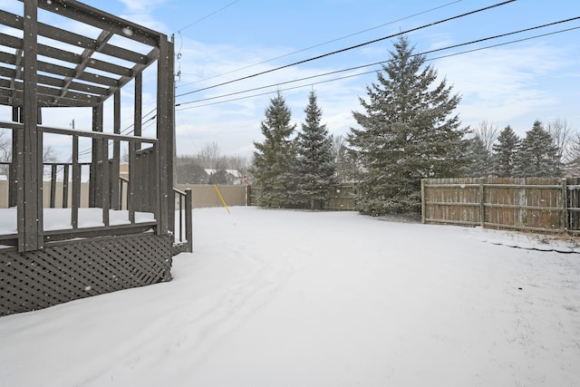 view of yard layered in snow