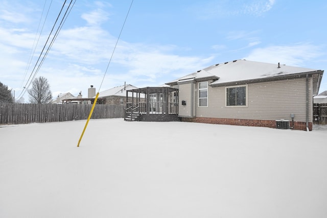 snowy yard with central air condition unit